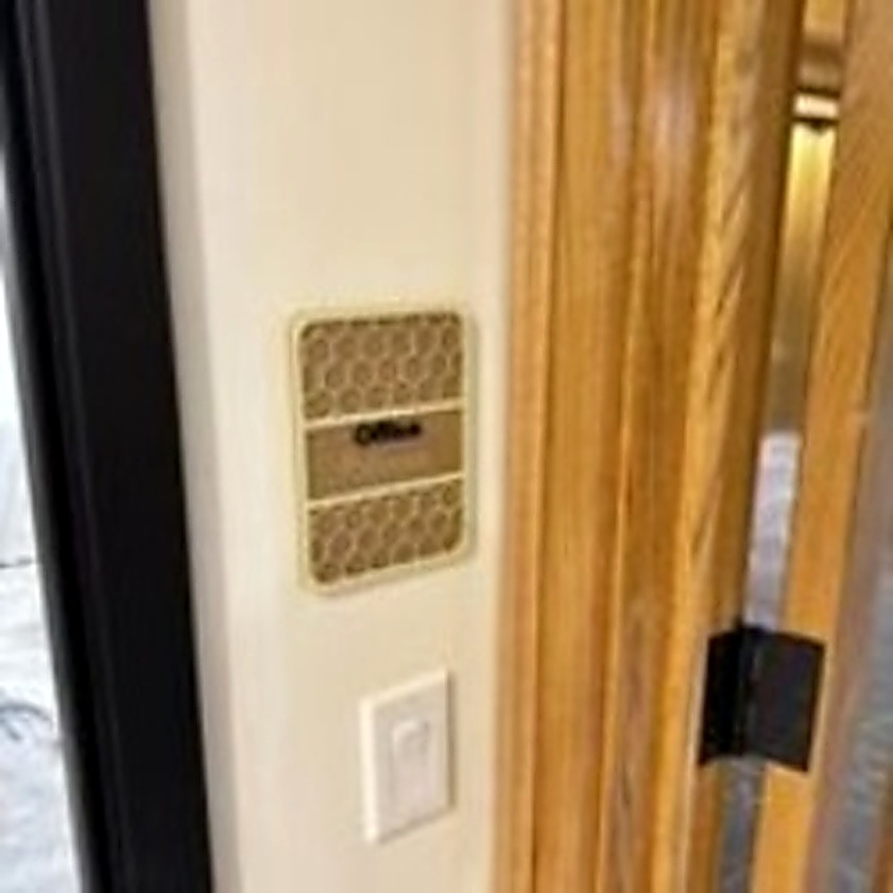 ADA office door sign with raised tactile lettering and Braille installed in a commercial space